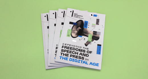 Image of stacked printed brochures that say "Defending the Freedoms of Speech and the Press in the Digital Age"